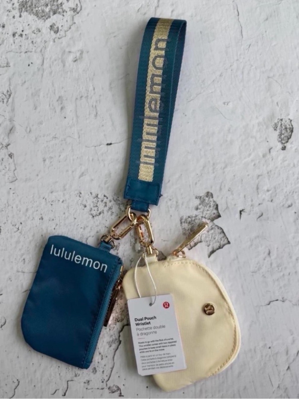 lululemon teal and cream dual pouch wristlet with branded strap